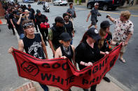 <p>A group of protesters known as “Antifa”, or anti-fascists, march near ths site of a makeshift memorial where Heather Heyer was killed last year Aug. 11, 2018 in Charlottesville, Va. (Photo: Win McNamee/Getty Images) </p>