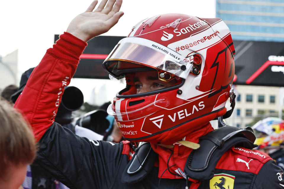 Ferrari driver Charles Leclerc of Monaco celebrates after setting the pole position in the qualifying session at the Baku circuit, in Baku, Azerbaijan, Saturday, June 11, 2022. The Formula One Grand Prix will be held on Sunday. (Hamad Mohammed, Pool Via AP)