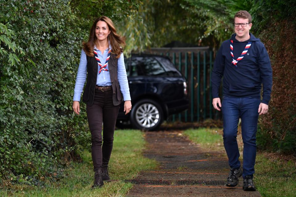 Britain's Catherine, Duchess of Cambridge (L) walks with Matt Hyde, Chief Executive of the Scouts, as she arrives to visit a Scout Group in Northolt, northwest London on September 29, 2020, where she joined Cub and Beaver Scouts in outdoor activities. - The Duchess learned how the Scouts have adapted during the COVID-19 pandemic, and continued Scouting sessions and online activities. (Photo by Daniel LEAL-OLIVAS / POOL / AFP) (Photo by DANIEL LEAL-OLIVAS/POOL/AFP via Getty Images)