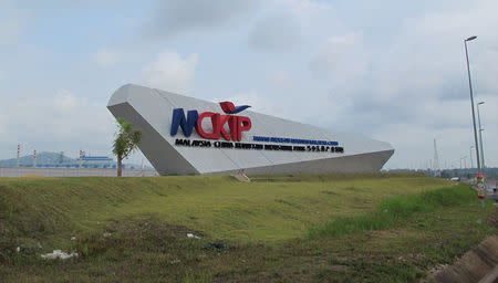 Signage for the 3,000-acre Malaysia-China Kuantan Industrial Park (MCKIP) is seen in Kuantan, Malaysia March 30, 2018. Picture taken March 30, 2018. REUTERS/Liz Lee