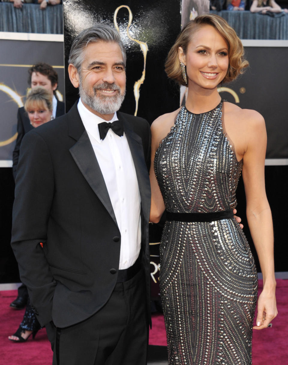 Actor George Clooney, left, and Stacy Keibler arrive at the Oscars at the Dolby Theatre on Sunday Feb. 24, 2013, in Los Angeles. (Photo by John Shearer/Invision/AP)