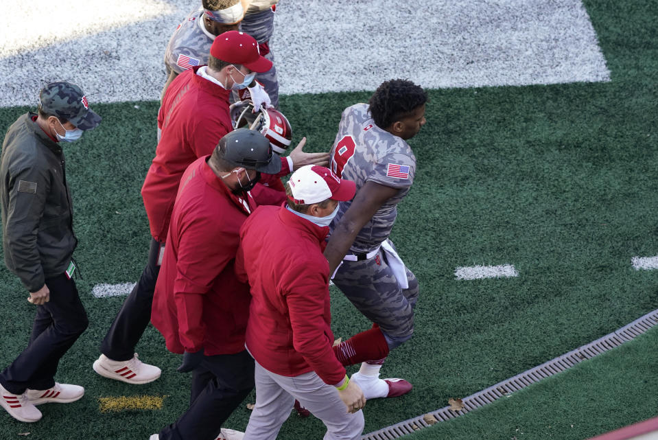 Indiana quarterback Michael Penix Jr. (9) is helped off the field after getting injured in the second half of an NCAA college football game against Maryland, Saturday, Nov. 28, 2020, in Bloomington, Ind. Indiana won 27-11. (AP Photo/Darron Cummings)