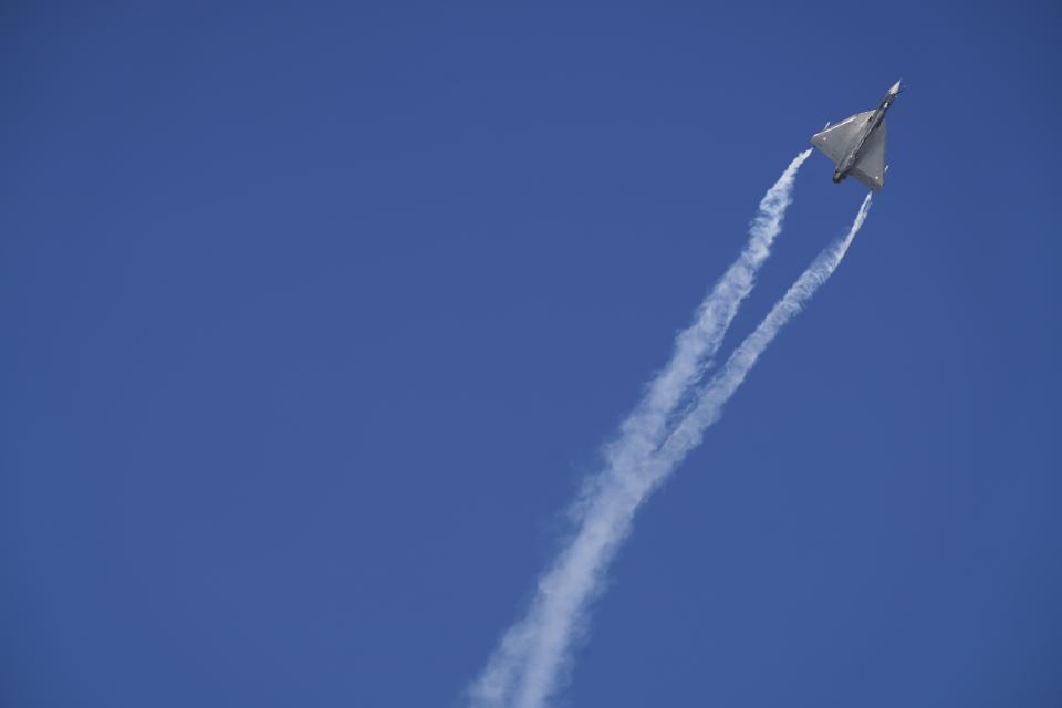 An Indian Air Force Tejas fighter jet performs a stunt at the Dubai Air Show in Dubai, United Arab Emirates, Wednesday, Nov. 17, 2021. (AP Photo/Jon Gambrell)
