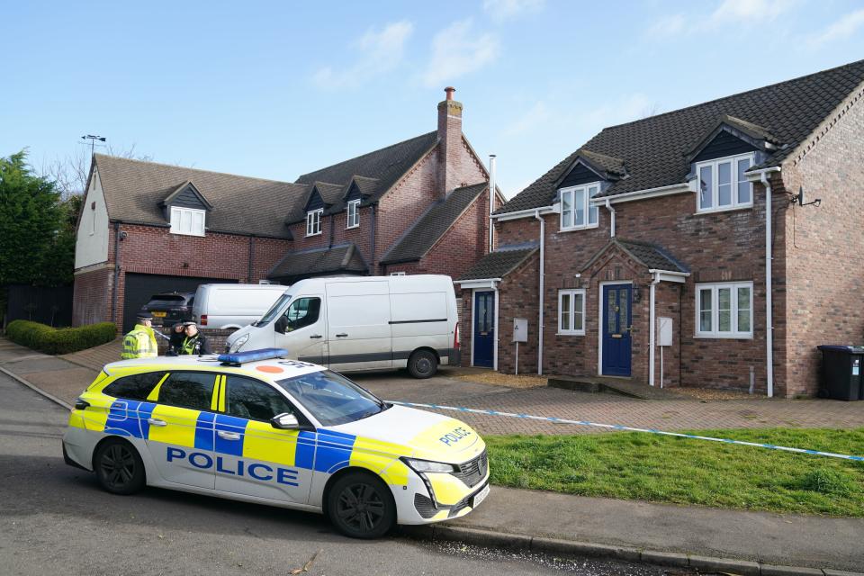 Police at the scene in The Row in Sutton, near Ely, Cambridgeshire (PA)