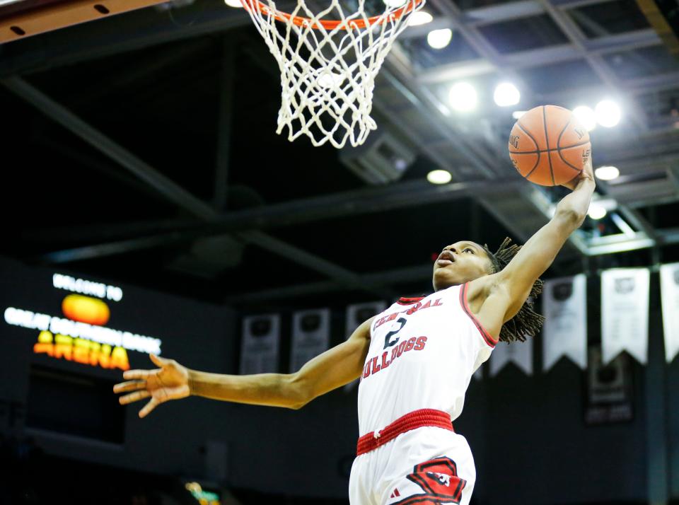 Central's Tyrique Brooks dunks the ball as the Bulldogs take on the Glendale Falcons in the Gold Division championship game of the Blue and Gold Tournament at Great Southern Bank Arena on Friday, Dec. 29, 2023.