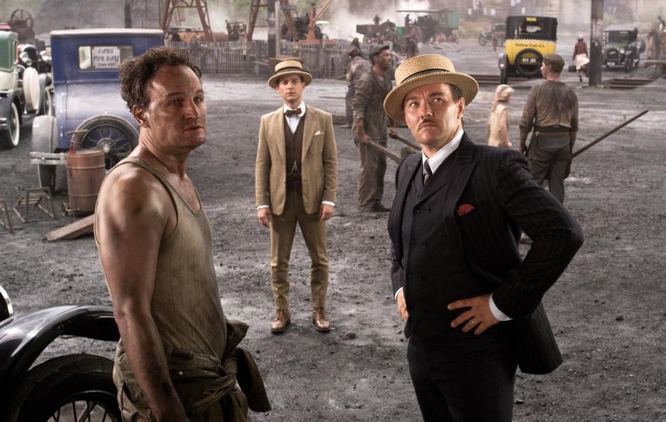 This film publicity image released by Warner Bros. Pictures shows Jason Clarke as George Wilson, left, Tobey Maguire as Nick Carraway, center, and Joel Edgerton as Tom Buchanan, right, in a scene from "The Great Gatsby." (AP Photo/Warner Bros. Pictures)