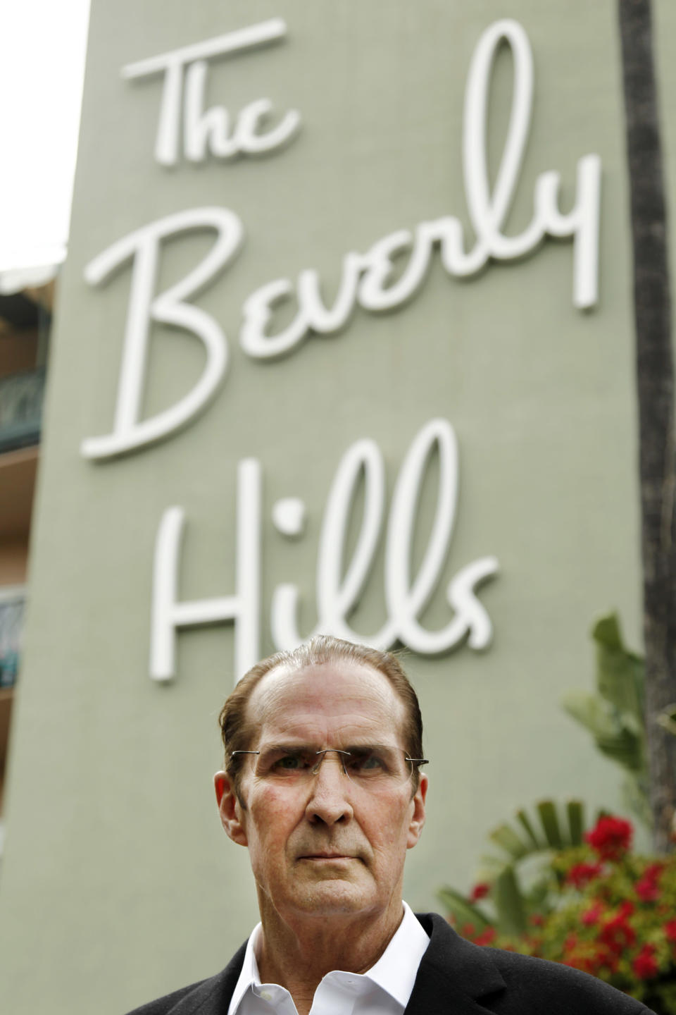 In this April 25, 2012 photo, Robert S. Anderson, author and Beverly Hills Hotel historian, poses for a portrait in front of the Beverly Hills Hotel in Beverly Hills, Calif. Anderson's book "The Beverly Hills Hotel - The First 100 Years" celebrates the 100th anniversary of the Beverly Hills Hotel. (AP Photo/Matt Sayles)