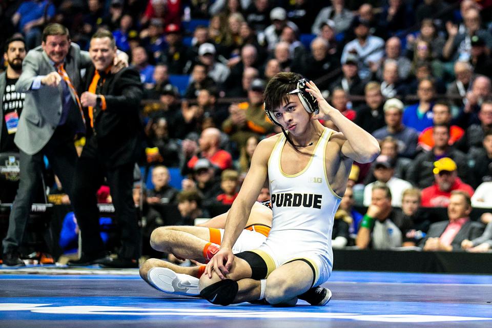 Purdue's Matt Ramos, right, reacts after losing his match to Princeton's Pat Glory at 125 pounds in the finals during the sixth session of the NCAA Division I Wrestling Championships, Saturday, March 18, 2023, at BOK Center in Tulsa, Okla.