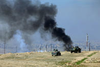 <p>Smoke rises from clashes during a battle with Islamic State militants south of Mosul, Iraq, Feb. 20, 2017. (Alaa Al-Marjani/Reuters) </p>