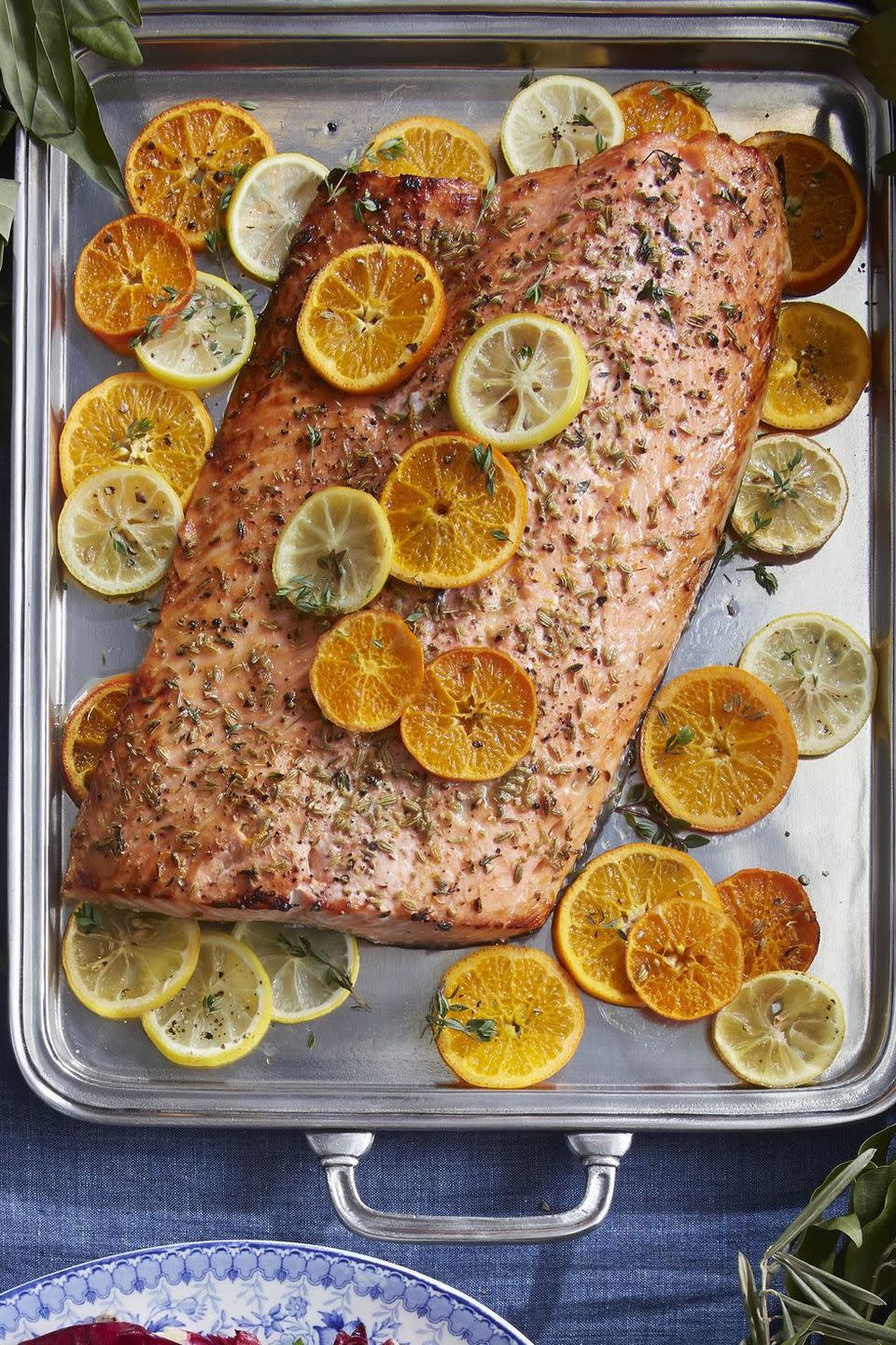 <p>For a lighter take on Christmas dinner, this rich, succulent salmon fillet is full of seasonal citrusy goodness, and opulent enough to feel fully festive.</p><p><strong><a href="https://www.countryliving.com/food-drinks/a34347516/citrus-roasted-salmon/" rel="nofollow noopener" target="_blank" data-ylk="slk:Get the recipe;elm:context_link;itc:0;sec:content-canvas" class="link ">Get the recipe</a>.</strong> </p>