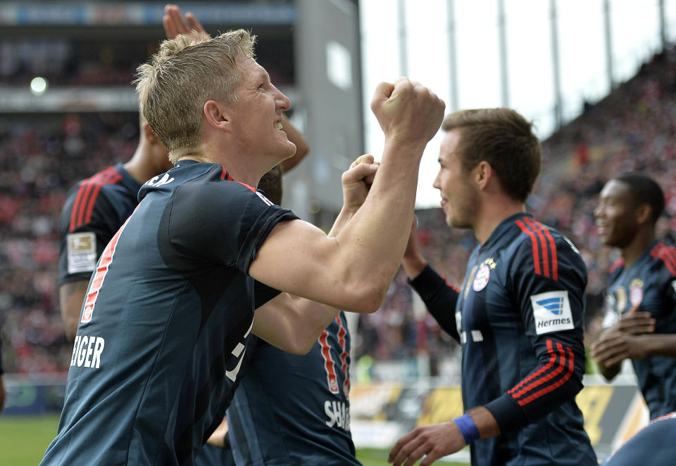 Bayern's Bastian Schweinsteiger celebrates after scoring during the German Bundesliga soccer match between FSV Mainz 05 and Bayern Munich in Mainz, Germany, Saturday, March 22, 2014. (AP Photo/Martin Meissner)