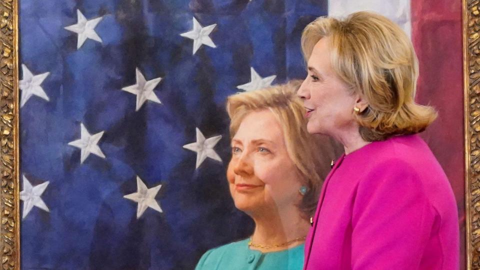 PHOTO: Former Secretary of State Hillary Rodham Clinton stands next to her portrait during its unveiling, at the State Department in Washington, Sept. 26, 2023. (Ken Cedeno/Reuters)