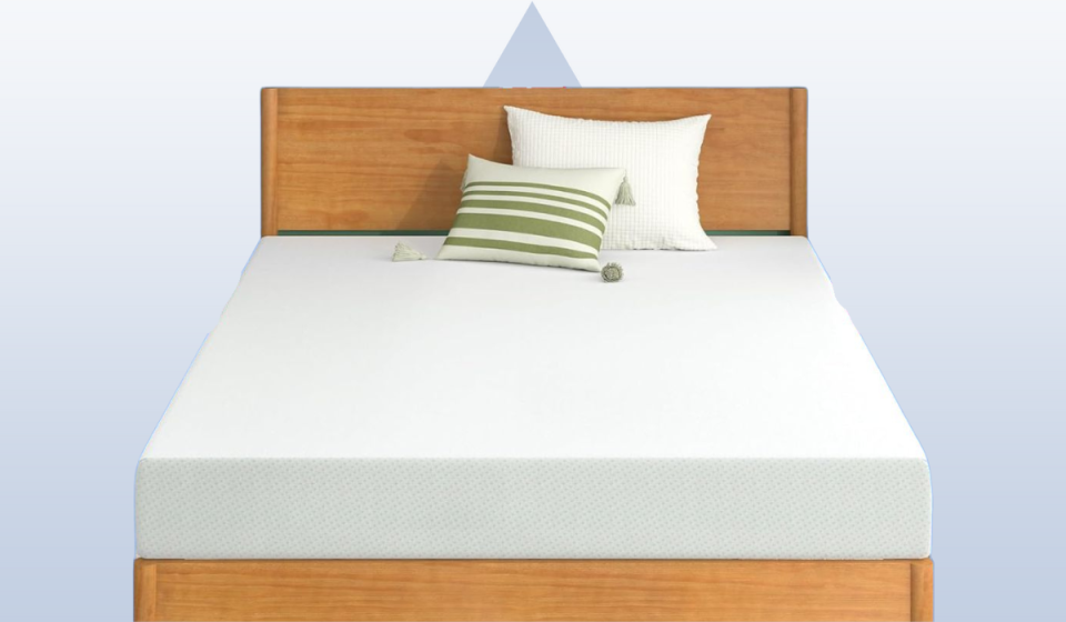 mattress on top of a bed with two pillows