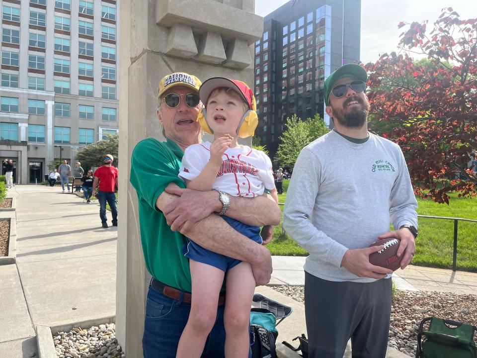 Herb Melton holds his Ian, 4, while viewing the planes flying over the city at Thunder Over Louisville on Saturday, April 20, 2024.