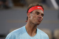 Spain's Rafael Nadal reacts in the first round match of the French Open tennis tournament against Egor Gerasimov of Belarus at the Roland Garros stadium in Paris, France, Monday, Sept. 28, 2020. (AP Photo/Alessandra Tarantino)