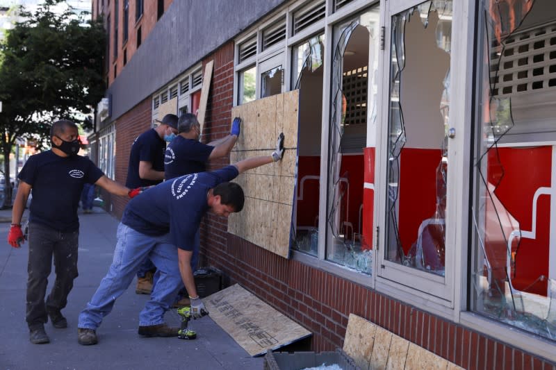 Damaged storefronts are seen during nationwide unrest following the death in Minneapolis police custody of George Floyd in Manhattan