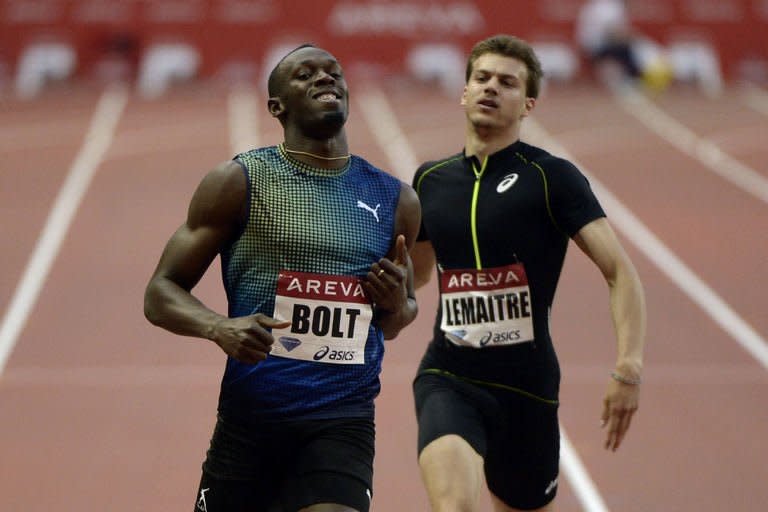 Jamaica's Usain Bolt crosses the finish line to win next to France's Christophe Lemaitre (R) during the men's 200m at the IAAF Diamond League athletics meeting in Saint-Denis, near Paris, on July 6, 2013. Bolt raced to a world-leading time of 19.73 seconds in the 200m at the Diamond League meet in Paris on Saturday