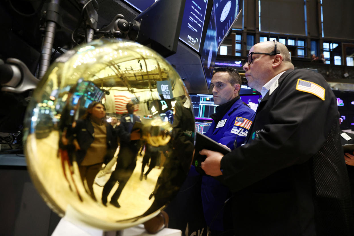 Traders work on the trading floor at the New York Stock Exchange (NYSE) in New York City, U.S., January 27, 2023. REUTERS/Andrew Kelly