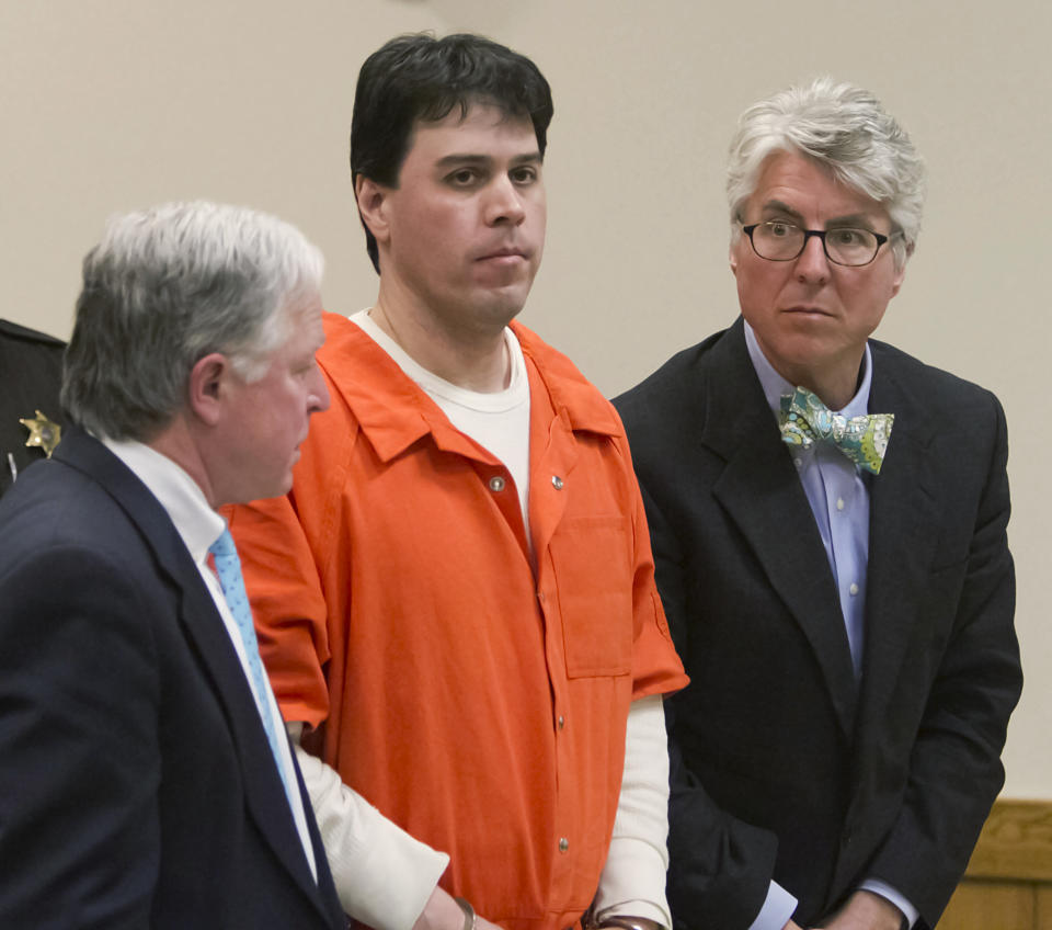 Raulie Casteel stands after sentencing in Livingston County, flanked by his attorneys Douglas Mullkoff, at left, and Charles Groh, in Howell, Mich., Monday, March 3, 2014. Casteel, who kept a swath of southeastern Michigan on edge for weeks by shooting at two-dozen vehicles along a busy highway corridor, was sentenced to 18 to 40 years in prison on a combination of terrorism and weapons convictions. (AP Photo/Livingston County Daily Press & Argus, Gillis Benedict, Pool)