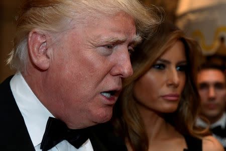 File Photo: U.S. President-elect Donald Trump talks to reporters as he and his wife Melania Trump arrive for a New Year's Eve celebration with members and guests at the Mar-a-lago Club in Palm Beach, Florida, U.S. December 31, 2016. REUTERS/Jonathan Ernst