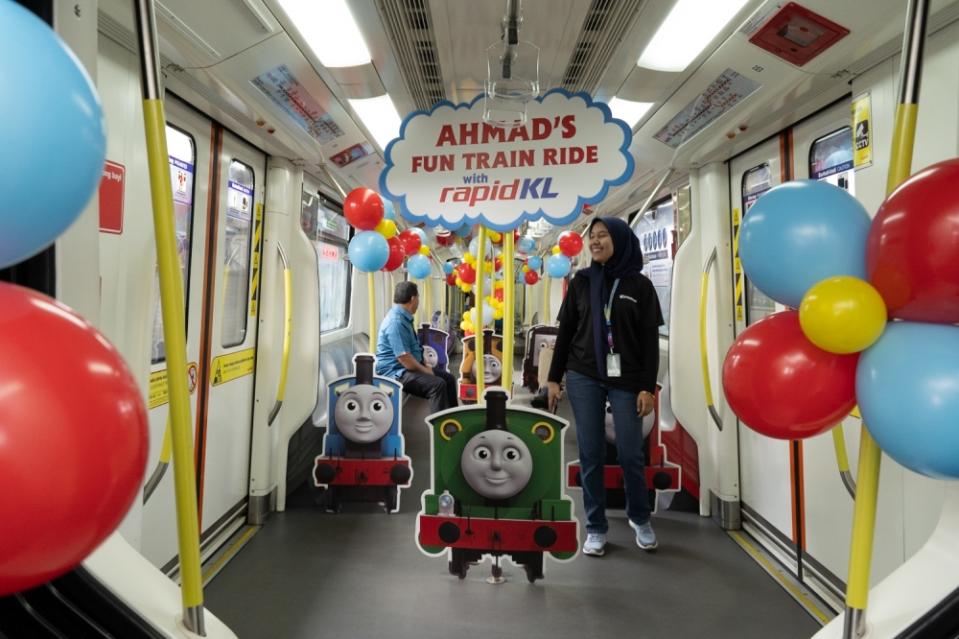 Prasarana reserved an extra train and decorated it with Thomas and Friends-themed decorations to give Ahmad an unforgettable birthday. — Picture by Raymond Manuel