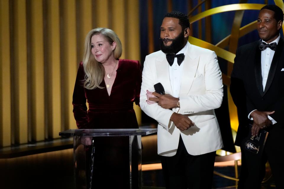 Anthony Anderson escorts Christina Applegate to present the award for outstanding supporting actress in a comedy series at the 75th Emmy Awards.