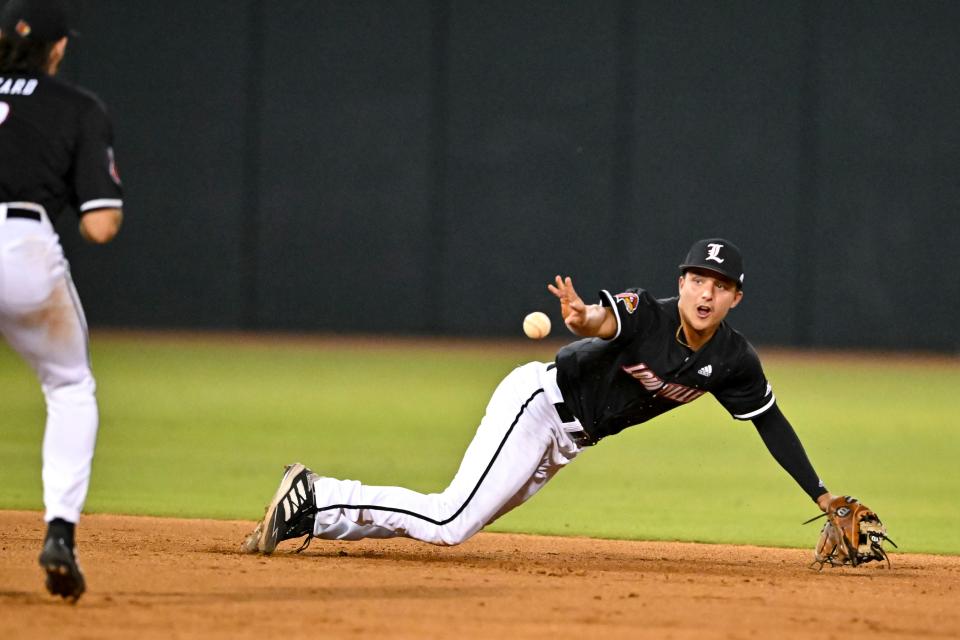 Jun 10, 2022; College Station, TX, USA; Louisville infielder Christian Knapczyk (9) bare hands a infield fly during the bottom  fifth inning during the super regional game one against the Texas A&M Mandatory Credit: Maria Lysaker-USA TODAY Sports