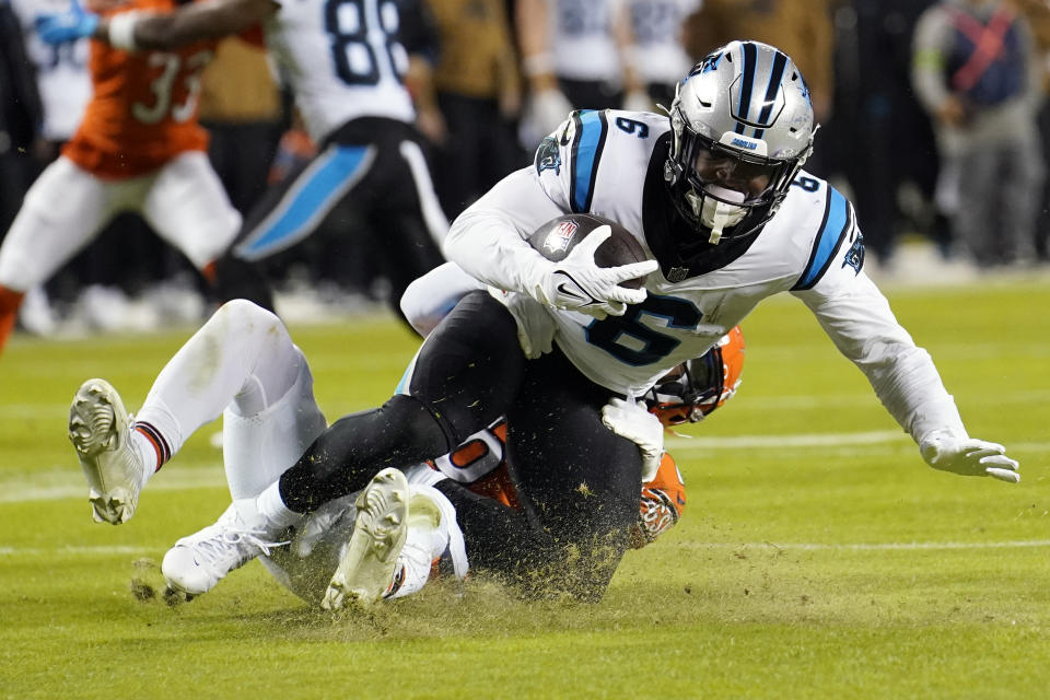 Carolina Panthers running back Miles Sanders (6) is tackled by Chicago Bears cornerback Kyler Gordon during the second half of an NFL football game Thursday, Nov. 9, 2023, in Chicago. (AP Photo/Charles Rex Arbogast)