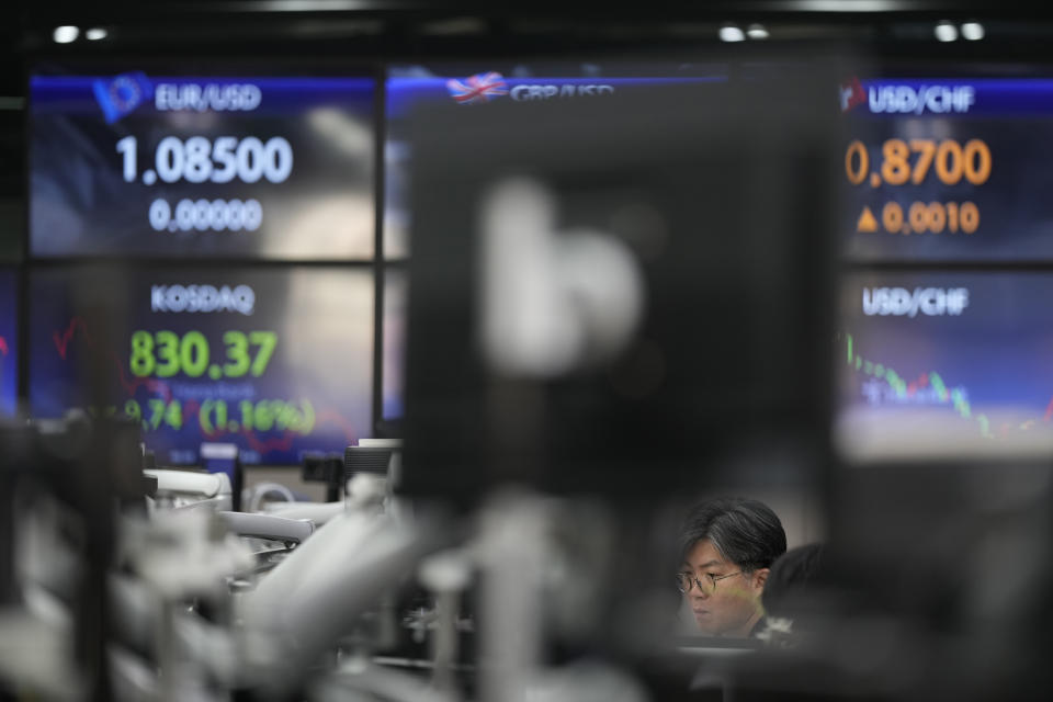 A currency trader watches computer monitors at a foreign exchange dealing room in Seoul, South Korea, Wednesday, Jan. 24, 2024. Asian shares are mixed after Japan reported its exports jumped nearly 10% in December over a year earlier. But shares in Tokyo fell nearly 1% after a recent strong rally as speculation revived over a shift away from longstanding lax monetary policy by the Bank of Japan. (AP Photo/Lee Jin-man)