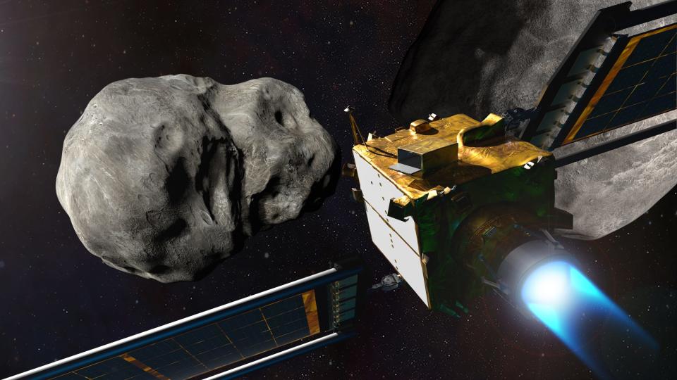 illustration shows spacecraft with two long solar panel wings and blue engine fire approaching an asteroid