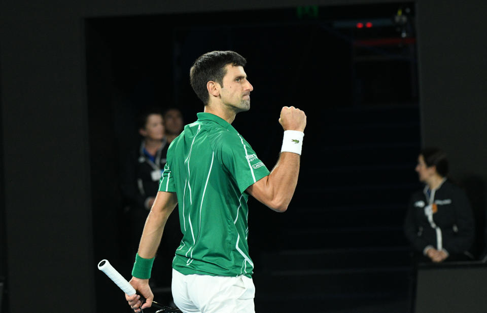 Novak Djokovic celebrates on the tennis court.