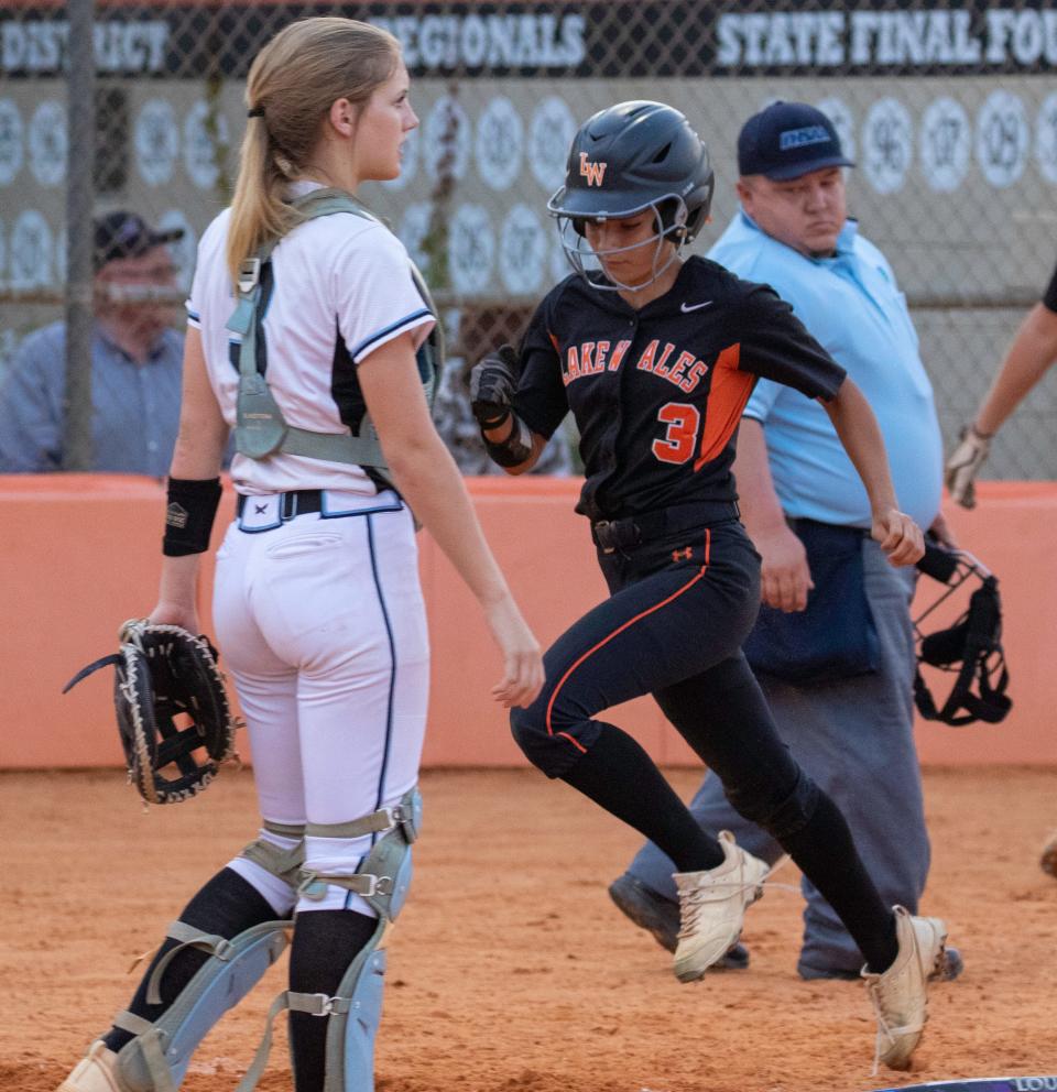 Lake Wales' Jaley Rodriguez scores on Zamya McBurrow's double in the third inning against Lake Region.