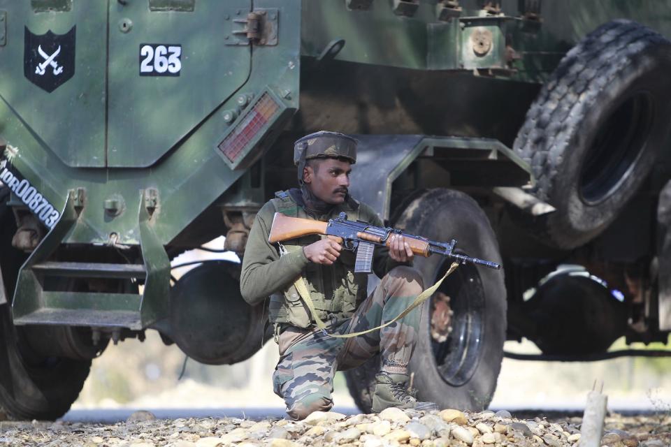 An Indian soldier keeps vigil during a search operation outside the camp of the General Engineering Reserve Force (GREF), the site of a militant attack, in the frontier Battal area, about 90 kilometers from Jammu, India, Monday, Jan. 9, 2017. The Indian army says three civilian laborers working with an army road construction crew were killed in a pre-dawn militant attack near the border with Pakistan in Indian-controlled Kashmir. (AP photo/Channi Anand)