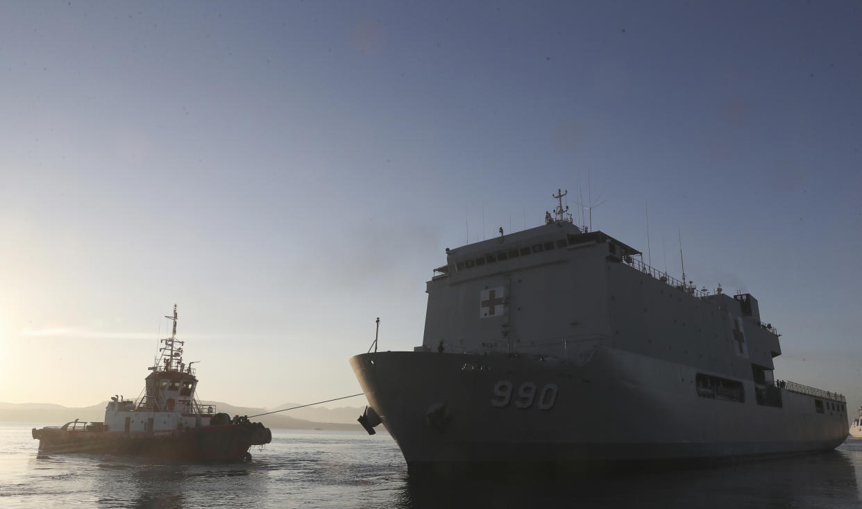 Indonesia navy hospital ship KRI Dr. Soeharso, right, sails to join the search for submarine KRI Nanggala that went missing while participating in a training exercise on Wednesday, off Banyuwangi, East Java, Indonesia, Saturday, April 24, 2021. Indonesian submarine The KRI Nanggala 402 went missing after its last reported dive Wednesday off the resort island, and concern is mounting it may have sunk too deep to reach or recover in time. (AP Photo/Achmad Ibrahim)