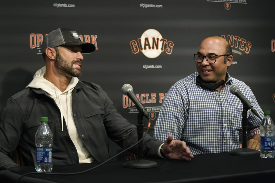 San Francisco Giants manager Gabe Kapler, left, speaks next to president of baseball operations Farhan Zaidi at a news conference in San Francisco, Monday, Oct. 18, 2021. (AP Photo/Jeff Chiu)