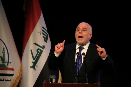 FILE PHOTO - Iraq's Prime Minister Haider al-Abadi speaks during a ceremony in Najaf, Iraq January 7, 2018. REUTERS/Alaa Al-Marjani