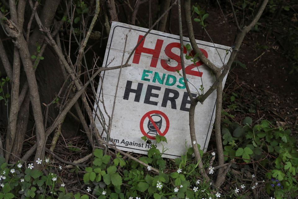 A placard for Stop HS2 campaign sits at the bottom of a tree at a development site for the High Speed 2 rail in Harefield, Britain April 28, 2019. REUTERS/Simon Dawson