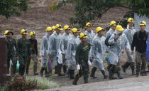 <p>Rescuers walk toward the entrance to the cave complex in Chiang Rai province, Thailand, on July 10, 2018. (Photo: Sakchai Lalit/AP) </p>