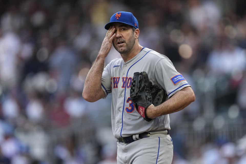 New York Mets starting pitcher Justin Verlander reacts during the first inning of the team's baseball game against the Atlanta Braves, Thursday, June 8, 2023, in Atlanta. (AP Photo/John Bazemore)