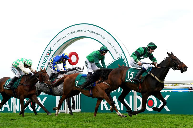 Arizona Cardinal, ridden by jockey Ciaran Gethings (right), winning the Randox Supports Race Against Dementia Topham Handicap Chase on day two of the 2024 Randox Grand National Festival at Aintree Racecourse on Friday, April 12 2024