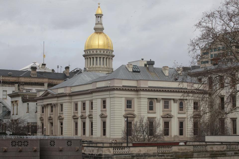 Photo of the New Jersey Statehouse. The capitol dome and the back of the statehouse.