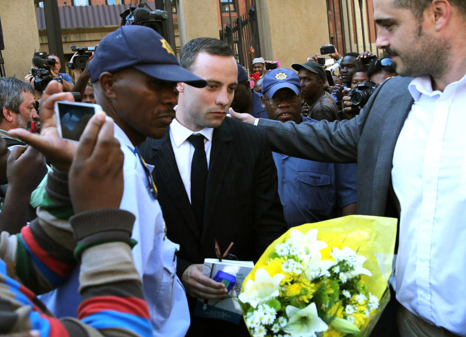 Oscar Pistorius leaves the high court in Pretoria, South Africa, Friday, April 11, 2014. Pistorius is charged with the murder of his girlfriend Reeva Steenkamp, on Valentines Day in 2013. (AP Photo/Themba Hadebe)