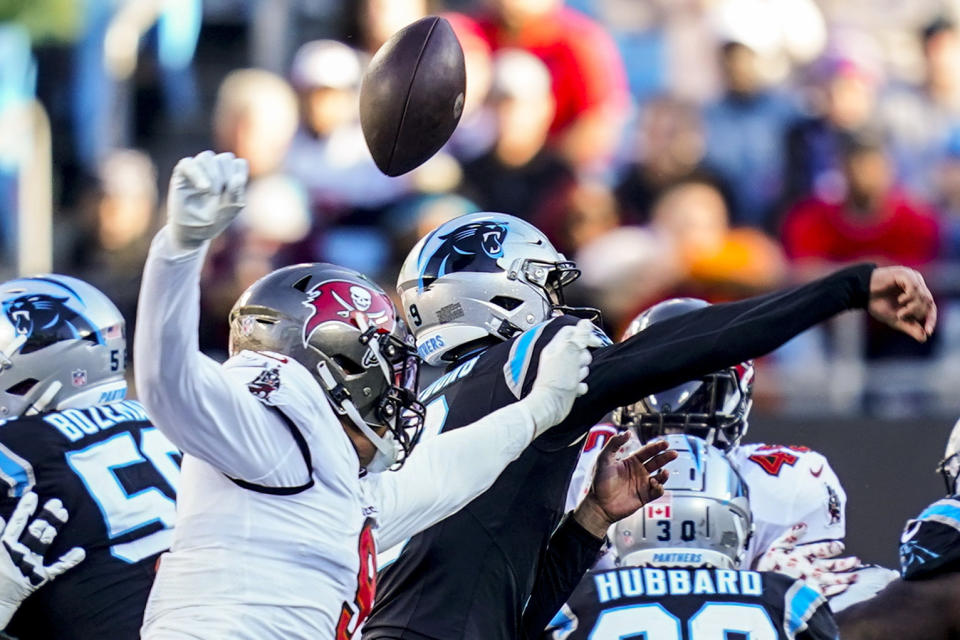 Tampa Bay Buccaneers linebacker Joe Tryon-Shoyinka (9) forces a fumble on Carolina Panthers quarterback Bryce Young (9) during the second half of an NFL football game, Sunday, Jan. 7, 2024, in Charlotte, N.C. (AP Photo/Erik Verduzco)