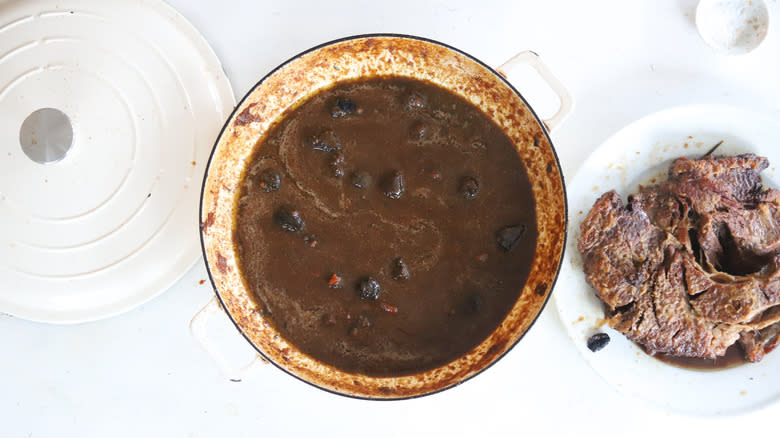 pot roast next to pot of broth