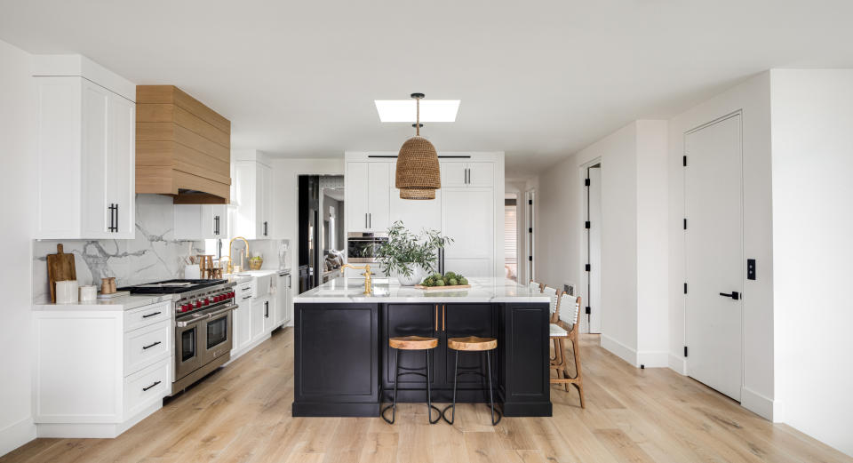 A kitchen with wood flooring