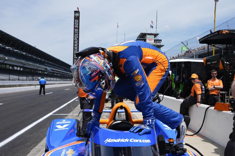 Kyle Larson climbs into his car during a practice session for the Indianapolis 500 auto race at Indianapolis Motor Speedway, Monday, May 20, 2024, in Indianapolis. (AP Photo/Darron Cummings)