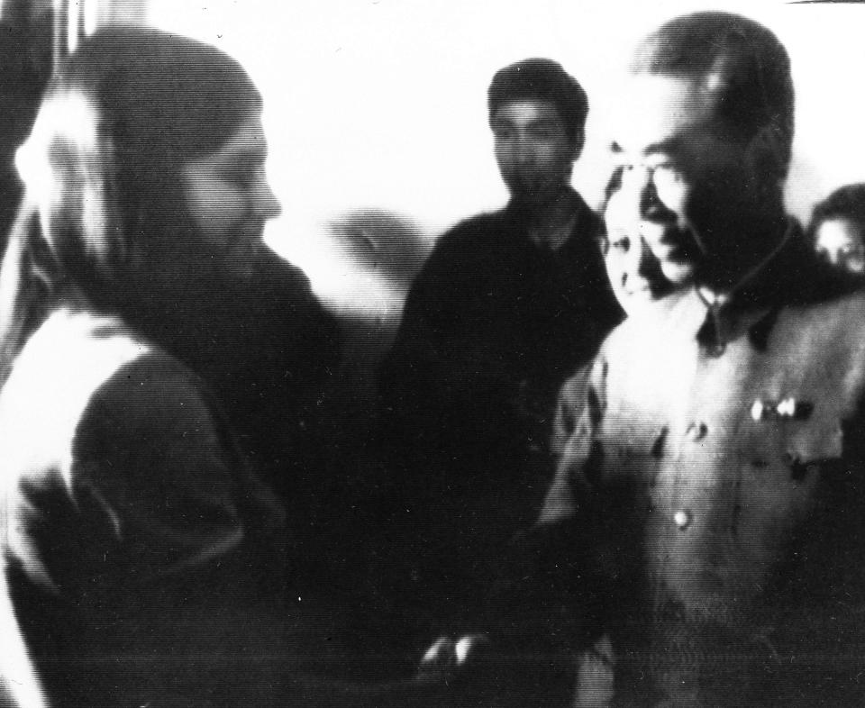 FILE - In this April 14, 1971, handout, United States table tennis team member Judy Bochenski, 15, left, then-known as Judy Hoarfrost, shakes hands with former China Premier Chow En-Lai in Peking, Communist China. Tossed into the middle of a slow thawing in U.S. relations with China, Judy Bochenski and her American ping pong teammates helped deliver perhaps the greatest diplomatic coup of their time. (AP Photo/File)