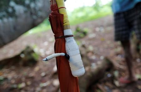 A bottle modified for drug consumption is seen near a place where people take drugs, along a street in Man Sam, northern Shan state, Myanmar July 11, 2016. Picture taken July 11, 2016. REUTERS/Soe Zeya Tun/Files