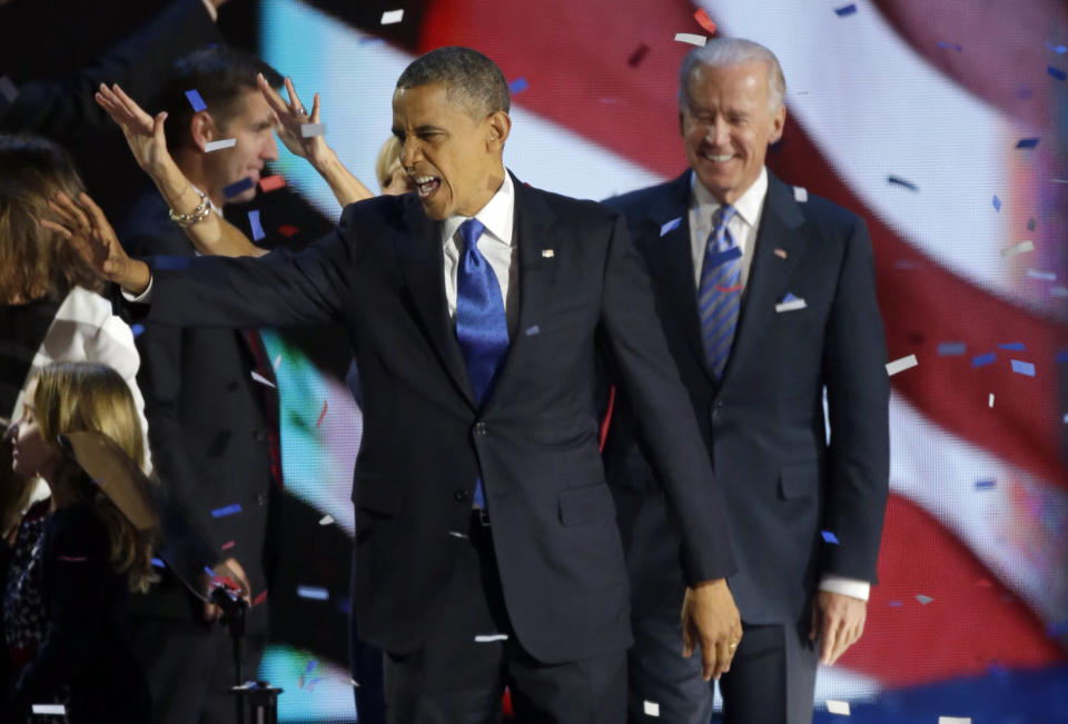 President Barack Obama waves to his supporters after his speech at his election night party Wednesday, Nov. 7, 2012, in Chicago. President Obama defeated Republican challenger former Massachusetts Gov. Mitt Romney. At right is Vice President Joe Biden. (AP Photo/Pablo Martinez Monsivais)