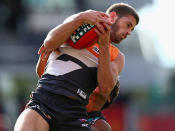 Callan Ward of the Giants marks during the round 12 AFL match between the Greater Western Sydney Giants and Port Adelaide Power at Skoda Stadium on June 16, 2013 in Sydney, Australia.